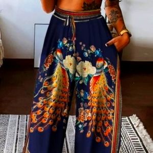 Brand new with tags two-piece silk white bra top in wide leg bottoms w/ Peacocks